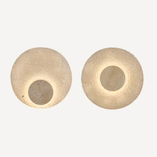 Exklusiv vägglampa i modern cirkulär design med akryl och sten för lyxig inredning